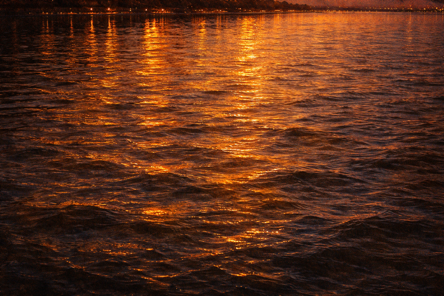 Golden light reflected on the Dnipro at dusk — the light Shevchenko described from the hill at Kaniv